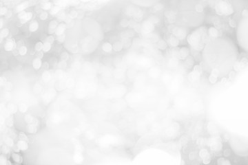 Abstract glamorous white and silver bokeh lights glitter sparkle. Defocused background have luxury...