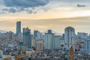 Hanoi skyline view with crane of under construction building at Thanh Cong lake, Ba Dinh district