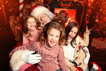 Fototapeta na wymiar cheerful kids with santa