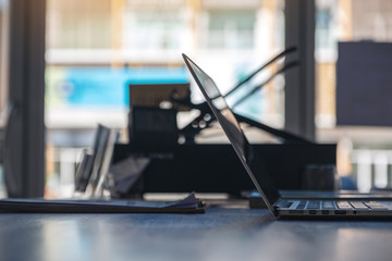 Closeup image of computer laptop on wooden table in office
