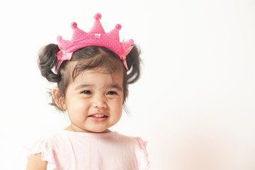 Portrait of happy smiling little girl isolated on white background. The concept is Asian kid with beautiful smile.
