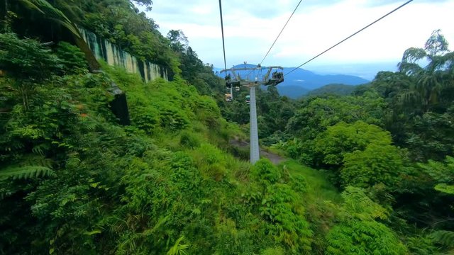 GENTING HIGHLANDS, MALAYSIA - 16 DECEMBER 2018 : Tourists travel on cable car of Genting Skyway. It is a gondola lift connecting Gohtong Jaya and Genting Highland.