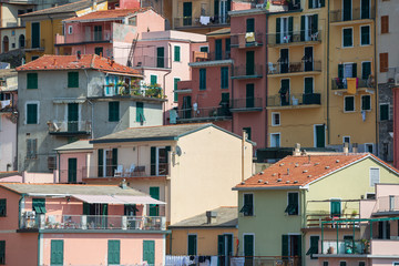 Fototapeta na wymiar Closeup view of colourful apartments in Manarola, one of the stunning Cinque Terre villages
