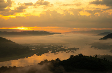 Landscape photo during sunrise and fog over Mekong river at the early morning ,shooting from the top of the mountain called  Phu-Huay-Esan hill located in Amphoe Sangkom, Nongkhai province,Thailand.