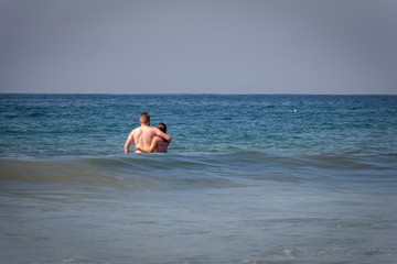 couple standing in ocean