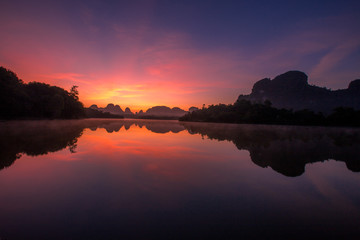 Backgrounds of scenery (nature), wallpaper close (mountains, swamps, trees) with a colorful atmosphere morning sunrise, natural beauty, seen during the trip.