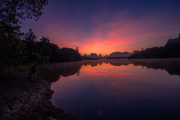 Backgrounds of scenery (nature), wallpaper close (mountains, swamps, trees) with a colorful atmosphere morning sunrise, natural beauty, seen during the trip.