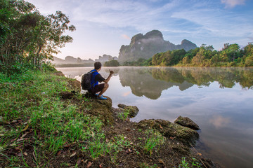 Krabi: August 30, 2018, male tourists come to watch the morning light at Ban Nong Talay, in Muang District, Thailand.