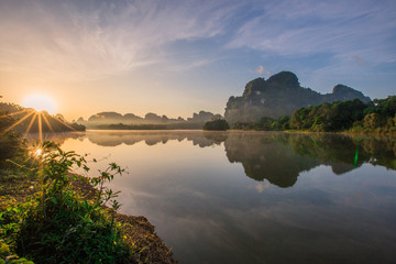 Backgrounds of scenery (nature), wallpaper close (mountains, swamps, trees) with a colorful atmosphere morning sunrise, natural beauty, seen during the trip.