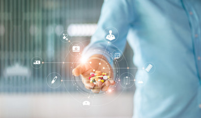 Medicine. Human holding drugs tablets and pills in hand with icon medical network connection on modern virtual screen interface, medicines, pharmaceutics and medical technology network concept