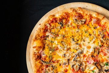 pizza on the black background