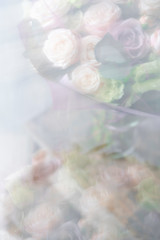 abstract blur. Bouquet of fresh spring flowers on gray wall background. Floral bunch in glass vase. flower shop, florist work