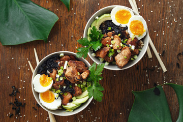 Asian food Two poke bowl fried rice chicken fillet eggs top view