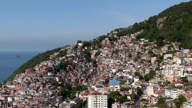 Rio de Janeiro, Brazil, aerial view, flying over favela Vidigal and Two Brothers mountain during daytime.