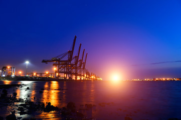 Fototapeta na wymiar Port crane bridge and bulk carrier