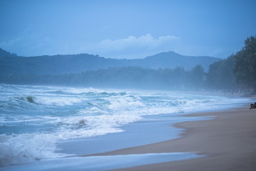 Fototapeta premium The background of the sea, with strong wind waves, storm wallpaper, caused by seasonal weather changes, and small boats should be taken off shore.