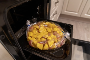 Potatoes and Chunks of Meat in sleeve for baking