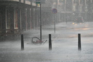 Forgotten bicycle under the rain in the street of Rotterdam. 