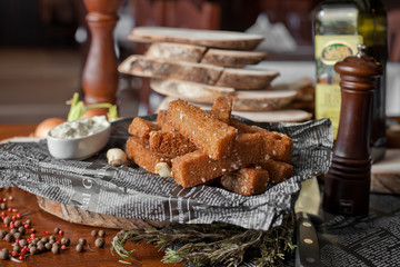 fried toasts with garlick sauce on a table