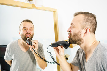 Man shaving trimming his beard