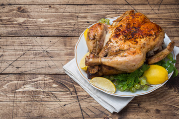 Baked chicken with stuffing for dinner on the holiday table. copy space