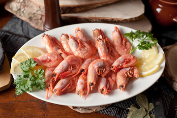 shrimps on a plate with lemons
