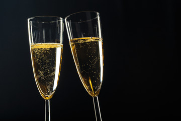 Champagne glasses for festive occasion against a dark background