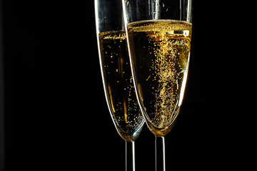 Champagne glasses for festive occasion against a dark background