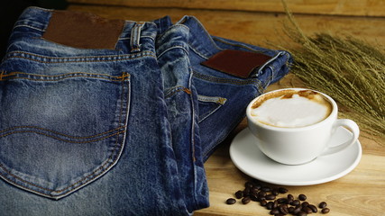 Blue jeans with leather label and red selvage. Jeans are type of garment and hard-wearing cotton...