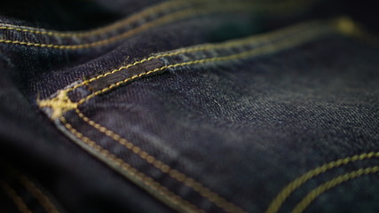 Blue jeans with leather label and red selvage. Jeans are type of garment and hard-wearing cotton...