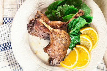 Duck legs confit with orange and salad