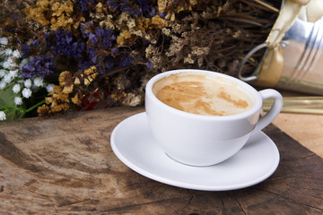 Cappuccino and latte art on the wood table. Free hand pouring some milk on the coffee. Morning breakfast with coffee.