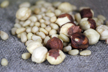 A handful of hazelnuts on a white background