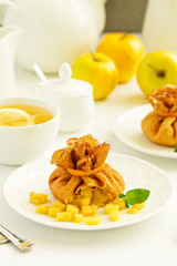 Russian pancakes stuffed with apples and caramel.