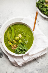 Green soup bowl plant based food broccoli, brussels sprout kale spinach cream soup