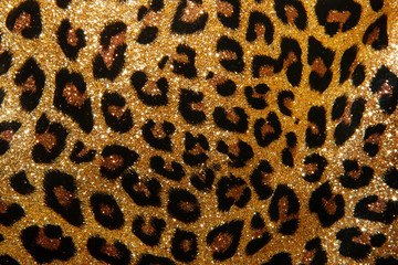 leopard texture of small sequins. bright beautiful background. glamour - obrazy, fototapety, plakaty