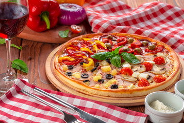 Delicious fresh pizza served on wooden table