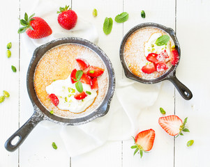almond pie with cream and strawberries. View from above.