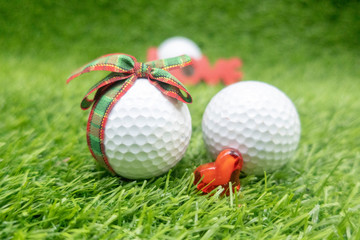 To golfer with love on Valentine's day with golf ball and red heart on green 