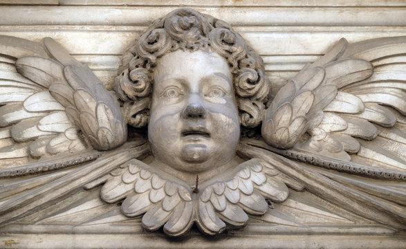 Angel on the portal of Santa Maria Corteorlandini church in Lucca, Tuscany, Italy