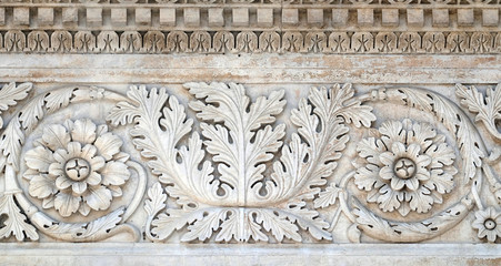 Stone carvings on the portal of Santa Maria Forisportam church in Lucca, Tuscany, Italy