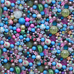 Colorful beads background in pink, blue, purple , white colours