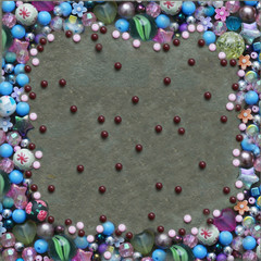 Colorful beads frame background in pink, blue, purple , white colours