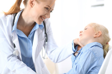 Fototapeta premium Doctor and a little blonde girl. Medicine and healthcare concept