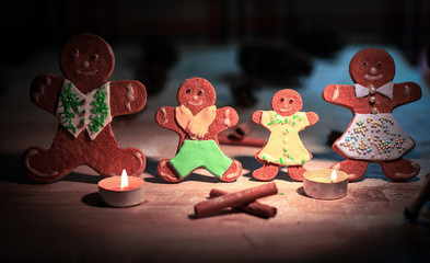 cheerful gingerbread men and house Christmas mug on the table