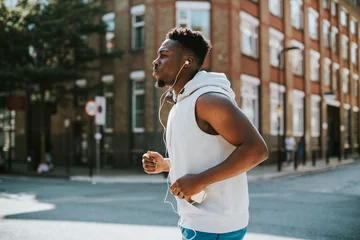 Papier Peint photo Lavable Jogging Athletic man running with earphones