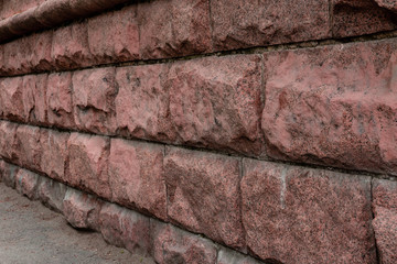 stone wall made of large granite blocks