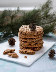 Winter breakfast with a glass of milk and some sweet homemade oatmeal cookies.
