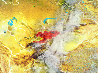 Obraz na płótnie Canvas Kyrgyzstan from space on model of planet Earth with country borders. Extremely fine detail of planet surface and clouds.