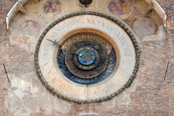 Clock tower of Palace of Reason (Palazzo della Ragione with the Torre dell'Orologio) in Mantua, Italy 